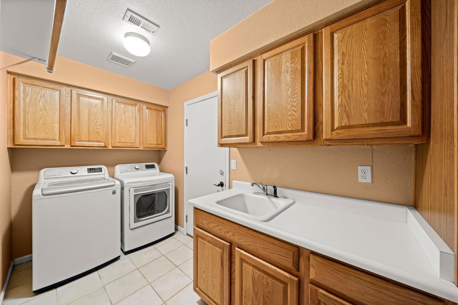 5116 Camden Road Rocklin, CA 95765 - Photo 13 of 31 a utility room with dryer and washer