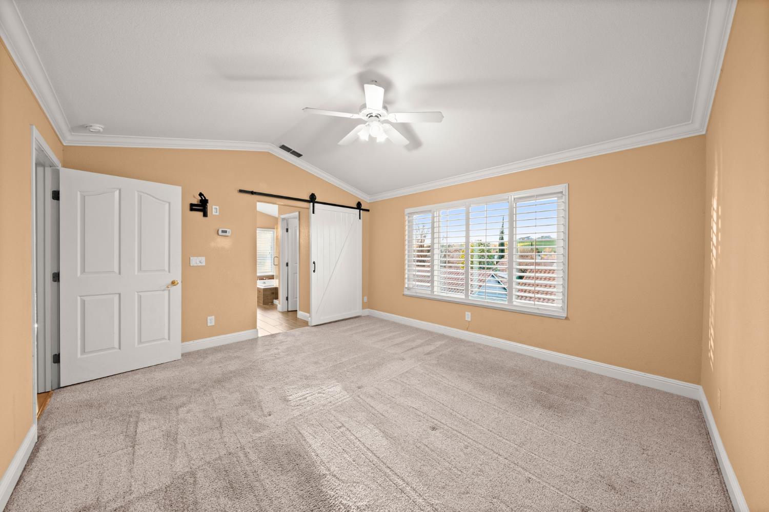 5116 Camden Road Rocklin, CA 95765 - Photo 24 of 31 a view of an empty room with chandelier fan and a window