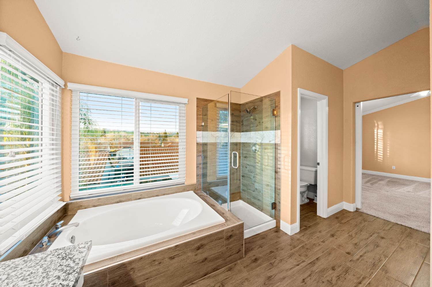 5116 Camden Road Rocklin, CA 95765 - Photo 27 of 31 a bathroom with a bathtub and a shower
