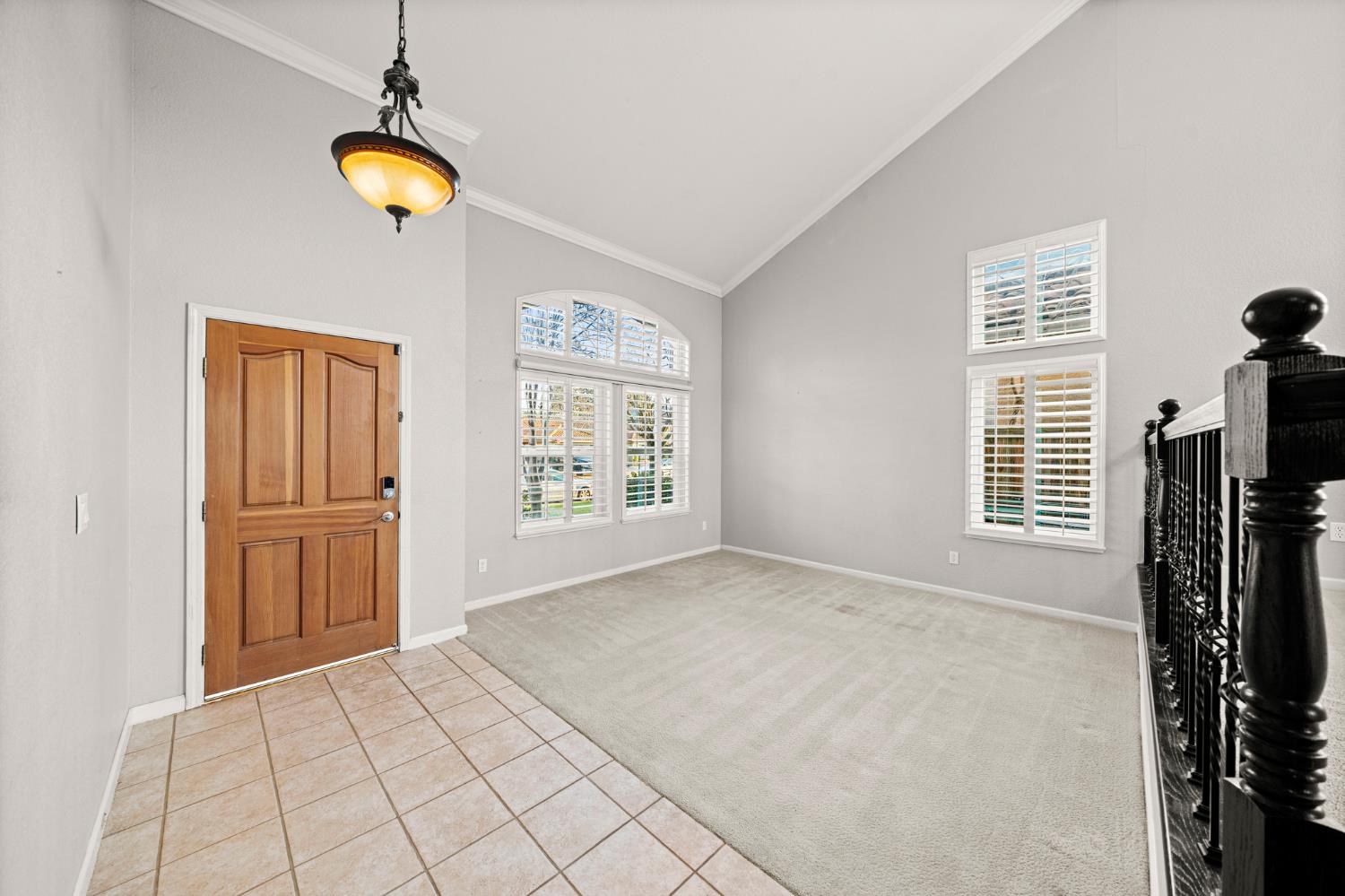 5116 Camden Road Rocklin, CA 95765 - Photo 9 of 31 a view of an empty room with window and chandelier fan