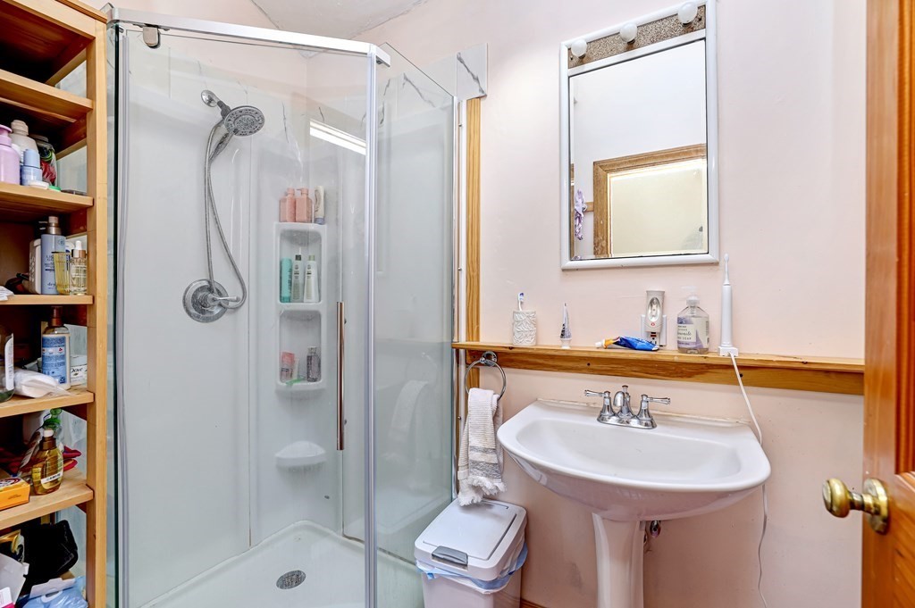 24-26 Crescent Street Cambridge, MA 02138 - Photo 14 of 36 a bathroom with a sink a toilet and shower