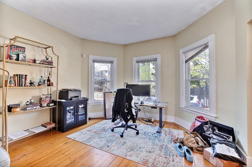 24-26 Crescent Street Cambridge, MA 02138 - Photo 20 of 36 a view of a workspace with furniture and a window
