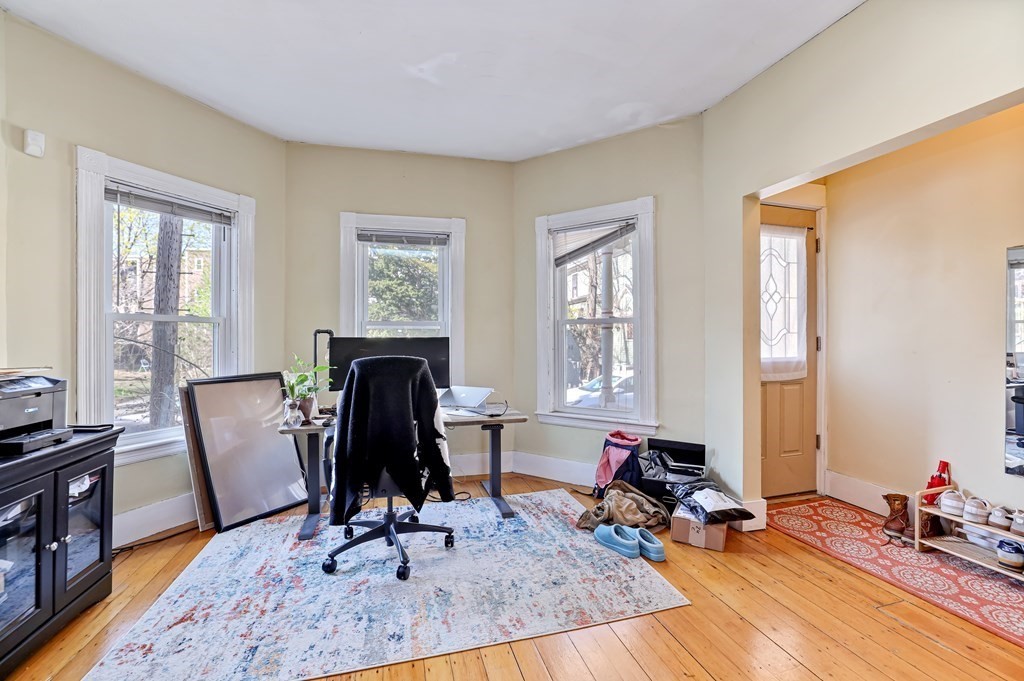 24-26 Crescent Street Cambridge, MA 02138 - Photo 21 of 36 a living room with furniture and wooden floor
