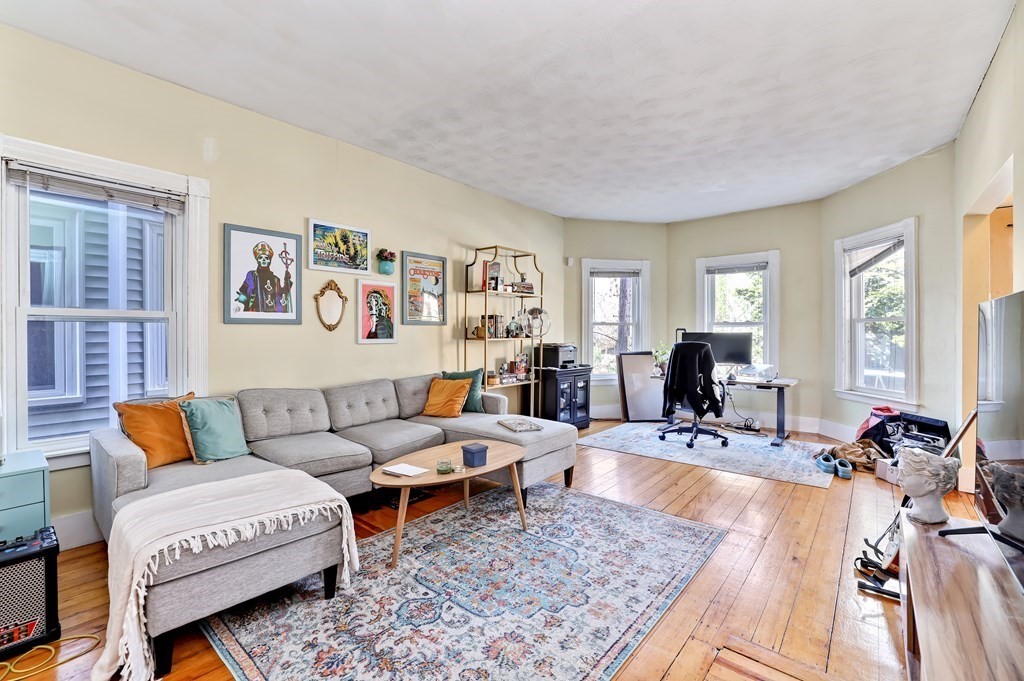 24-26 Crescent Street Cambridge, MA 02138 - Photo 22 of 36 a living room with furniture rug and window
