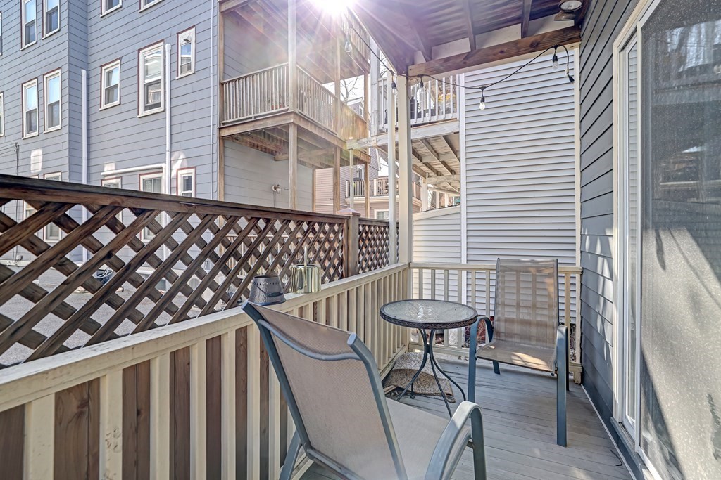 24-26 Crescent Street Cambridge, MA 02138 - Photo 31 of 36 a view of a balcony with chairs