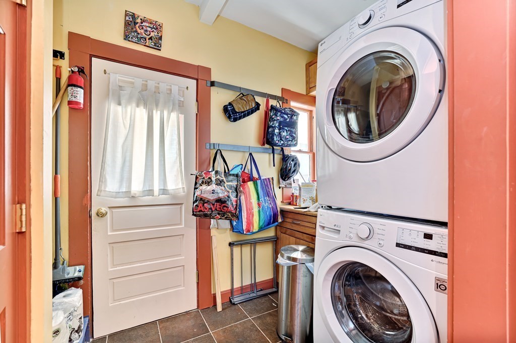 24-26 Crescent Street Cambridge, MA 02138 - Photo 8 of 36 a view of a storage & utility room with dryer and washer