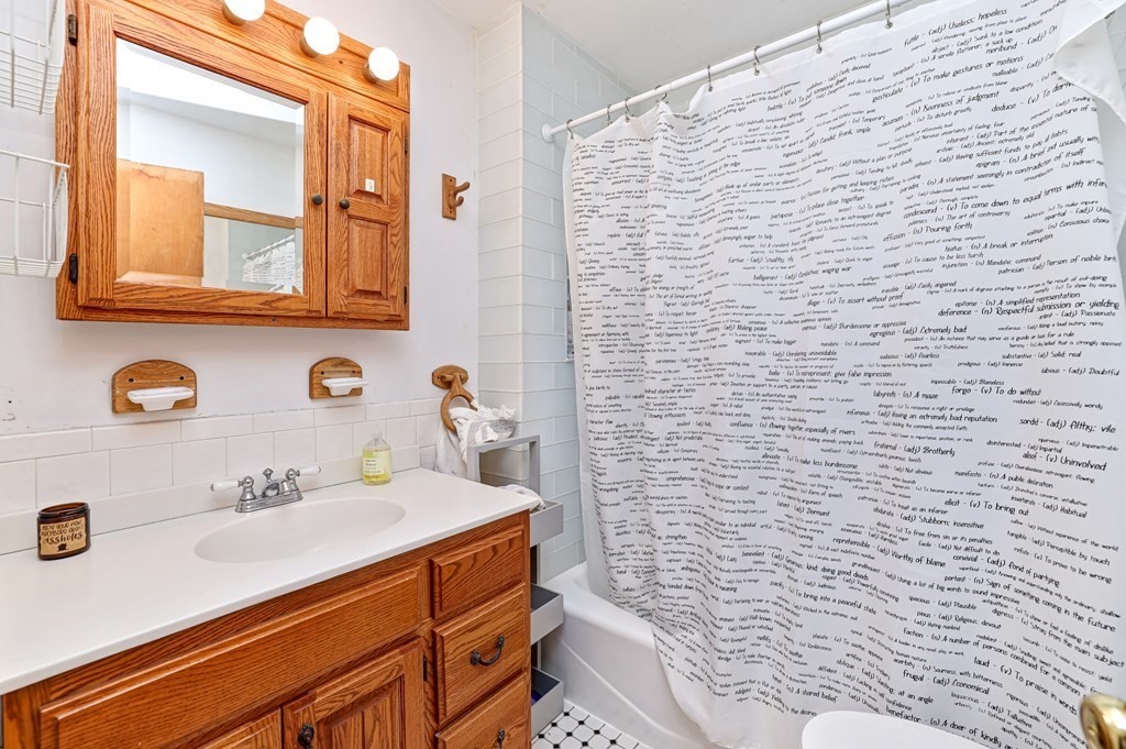 24-26 Crescent Street Cambridge, MA 02138 - Photo 9 of 36 a bathroom with a sink and a mirror