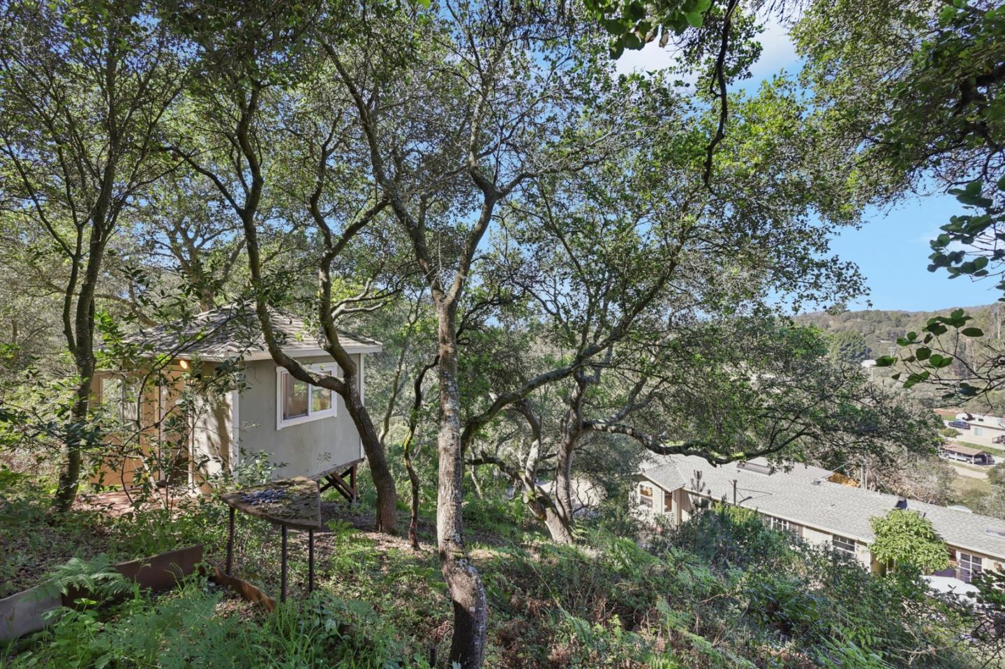122 Strawberry Road Watsonville, CA 95076 - Photo 35 of 57 a backyard of a house with table and chairs