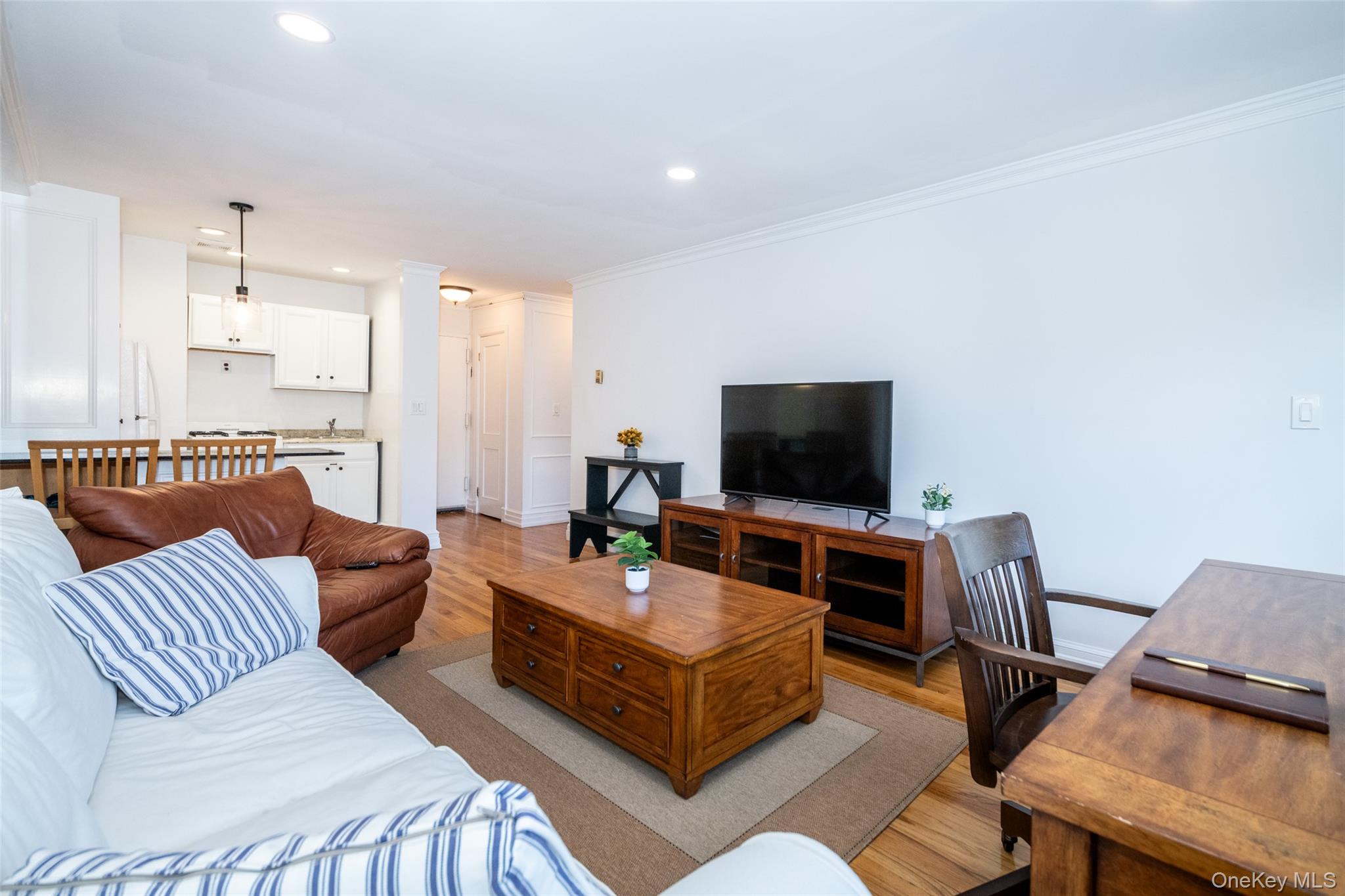 2221 Palmer Avenue, Unit 3D New Rochelle, NY 10801 - Photo 6 of 18 a living room with furniture and a flat screen tv
