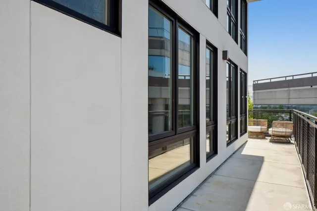 a view of balcony with furniture