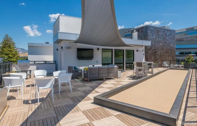a kitchen with kitchen island a sink counter top space stainless steel appliances and cabinets