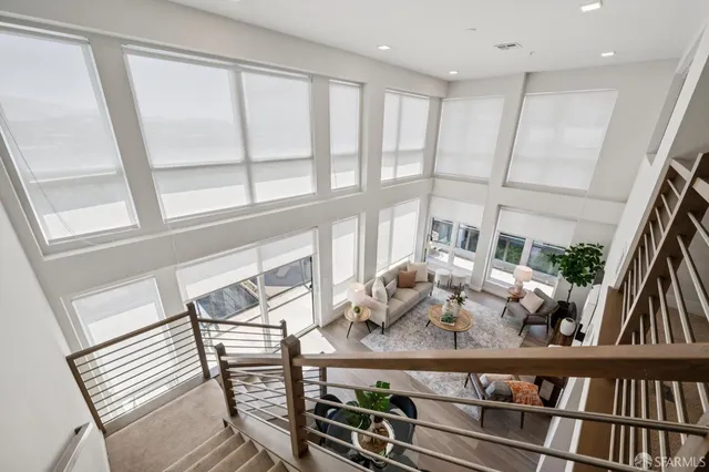 a bedroom with bed and wooden floor