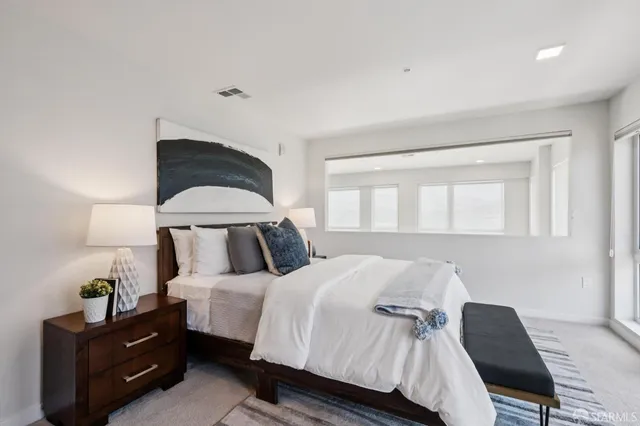 a room with furniture and a potted plant