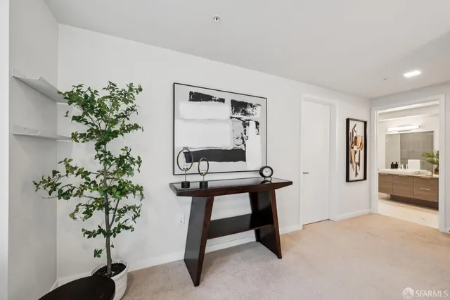 a white bath tub sitting next to a white sink