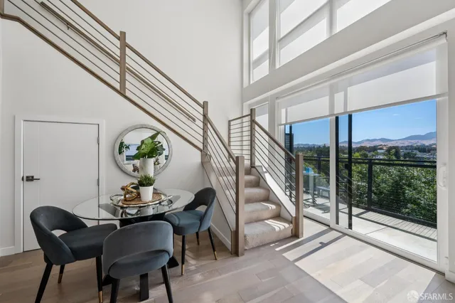 a view of a livingroom with furniture and front door