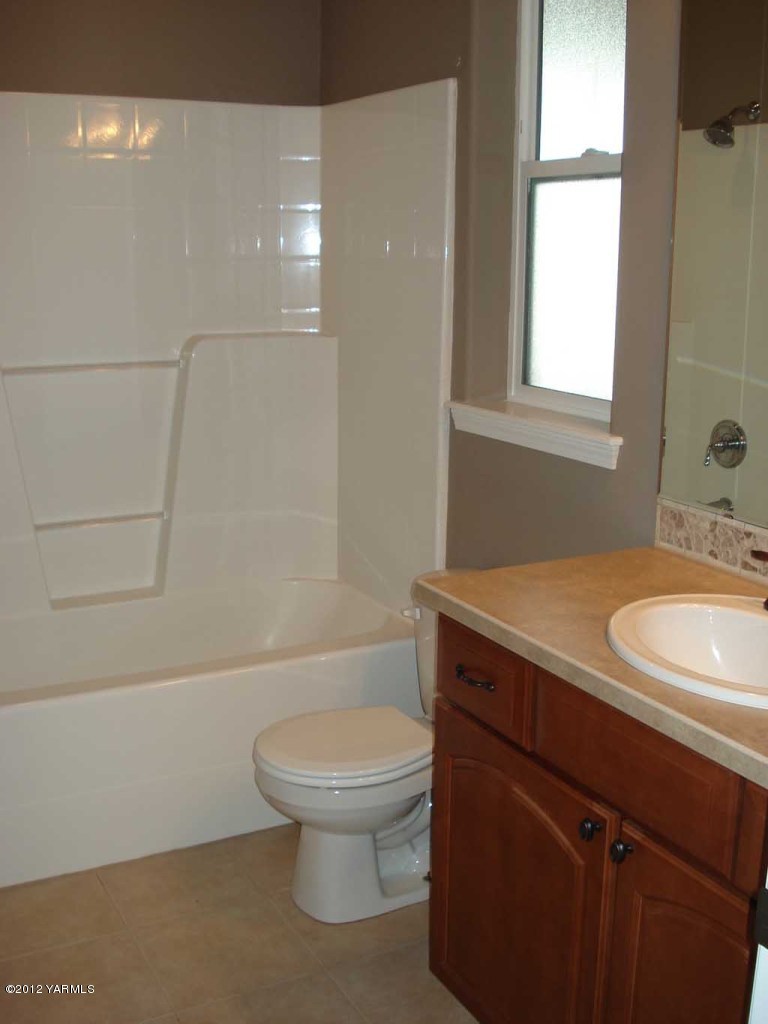 840 Dilley Road Tieton, WA 98947 - Photo 12 of 23 a bathroom with a sink a toilet and shower