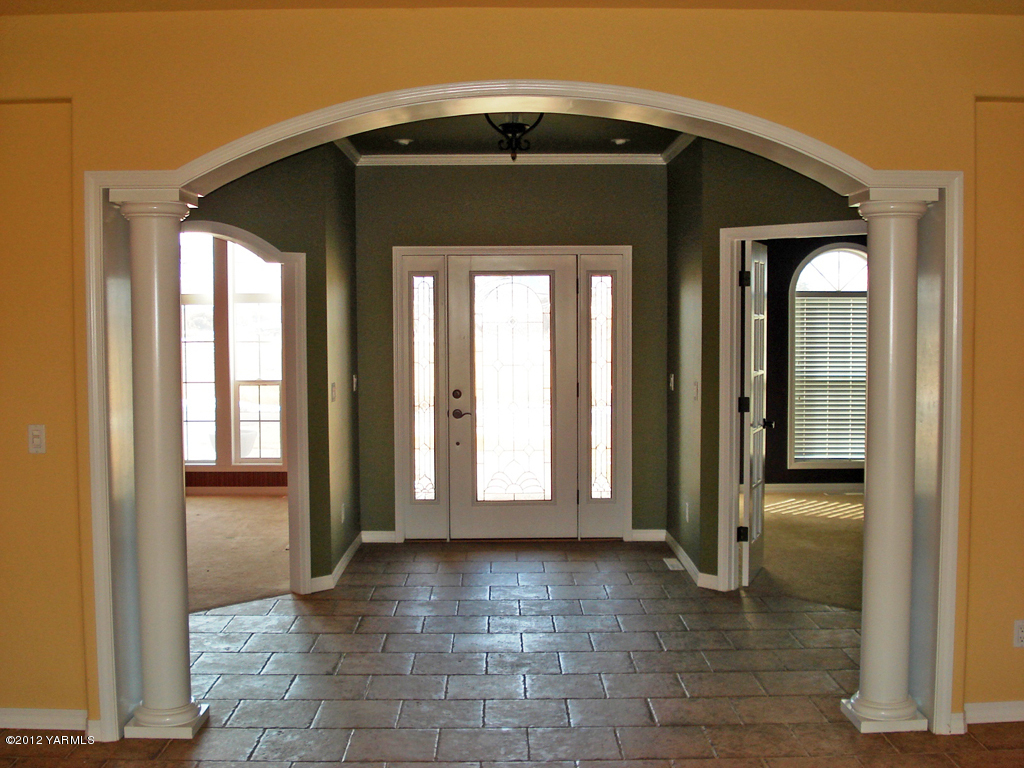 840 Dilley Road Tieton, WA 98947 - Photo 3 of 23 a view of a front door and a hallway with wooden floor