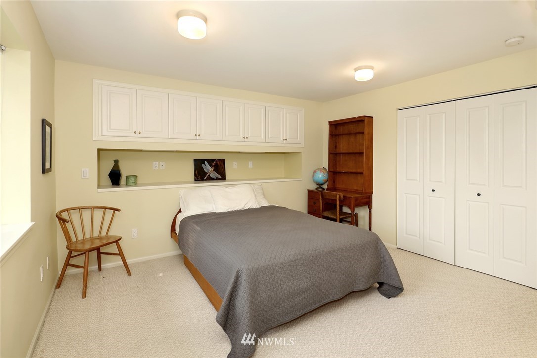 632 Fieldston Road Bellingham, WA 98225 - Photo 28 of 40 a bedroom with a bed and a chair