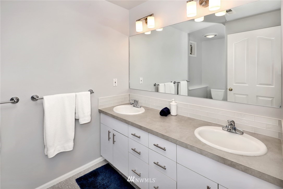 632 Fieldston Road Bellingham, WA 98225 - Photo 36 of 40 a bathroom with a double vanity sink and mirror