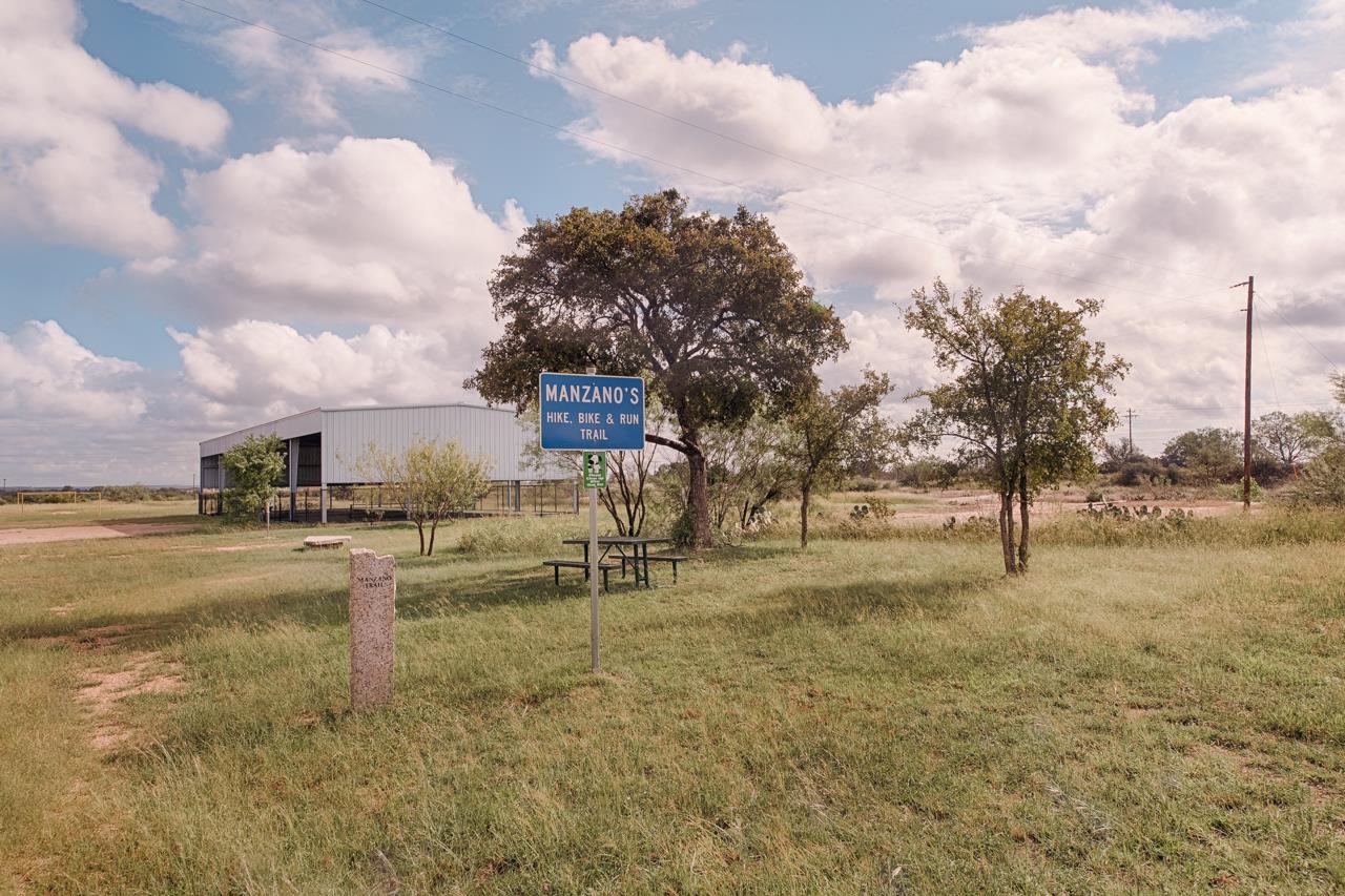 2802 Valley View Lane Granite Shoals, TX 78654 - Photo 11 of 14 a view of a yard with swimming pool and mountains