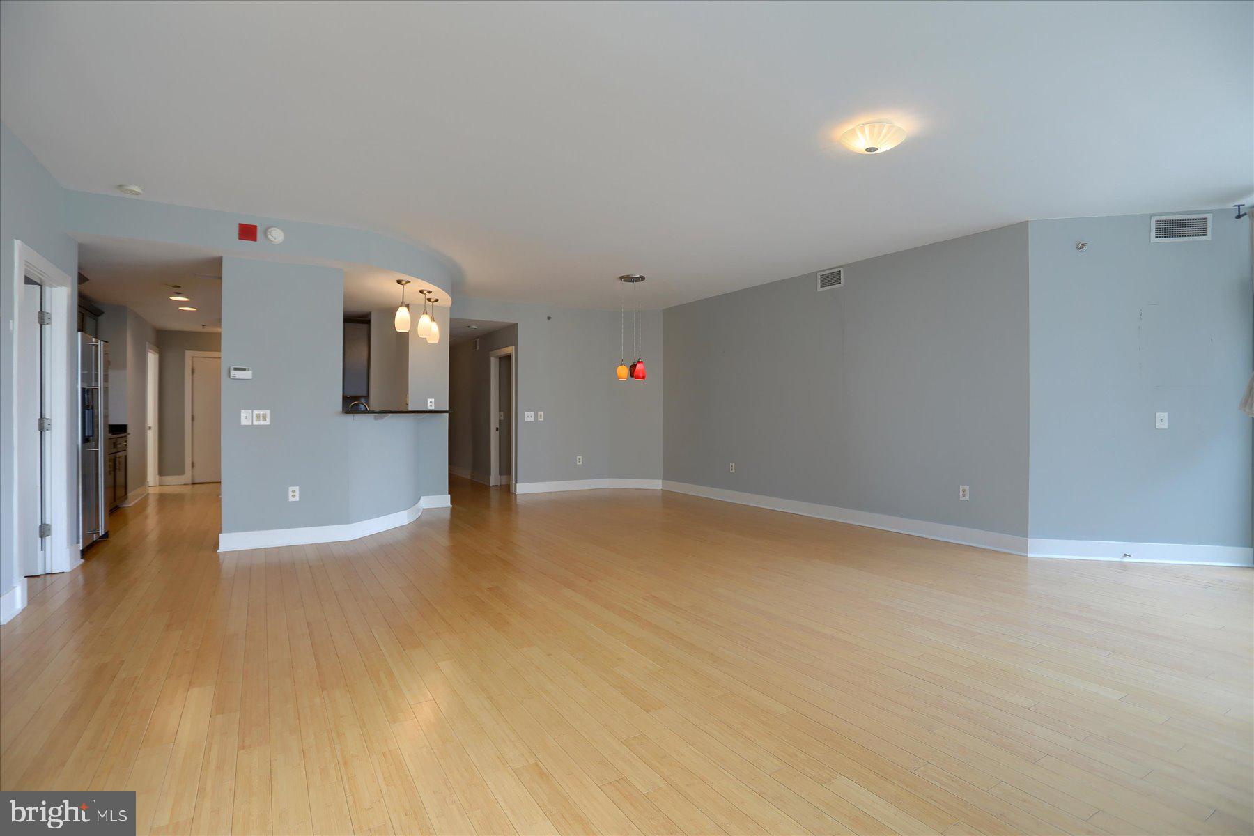 1400 Lancaster Street, Unit 802 Baltimore, MD 21231 - Photo 11 of 34 a view of a big room with wooden floor and a yard