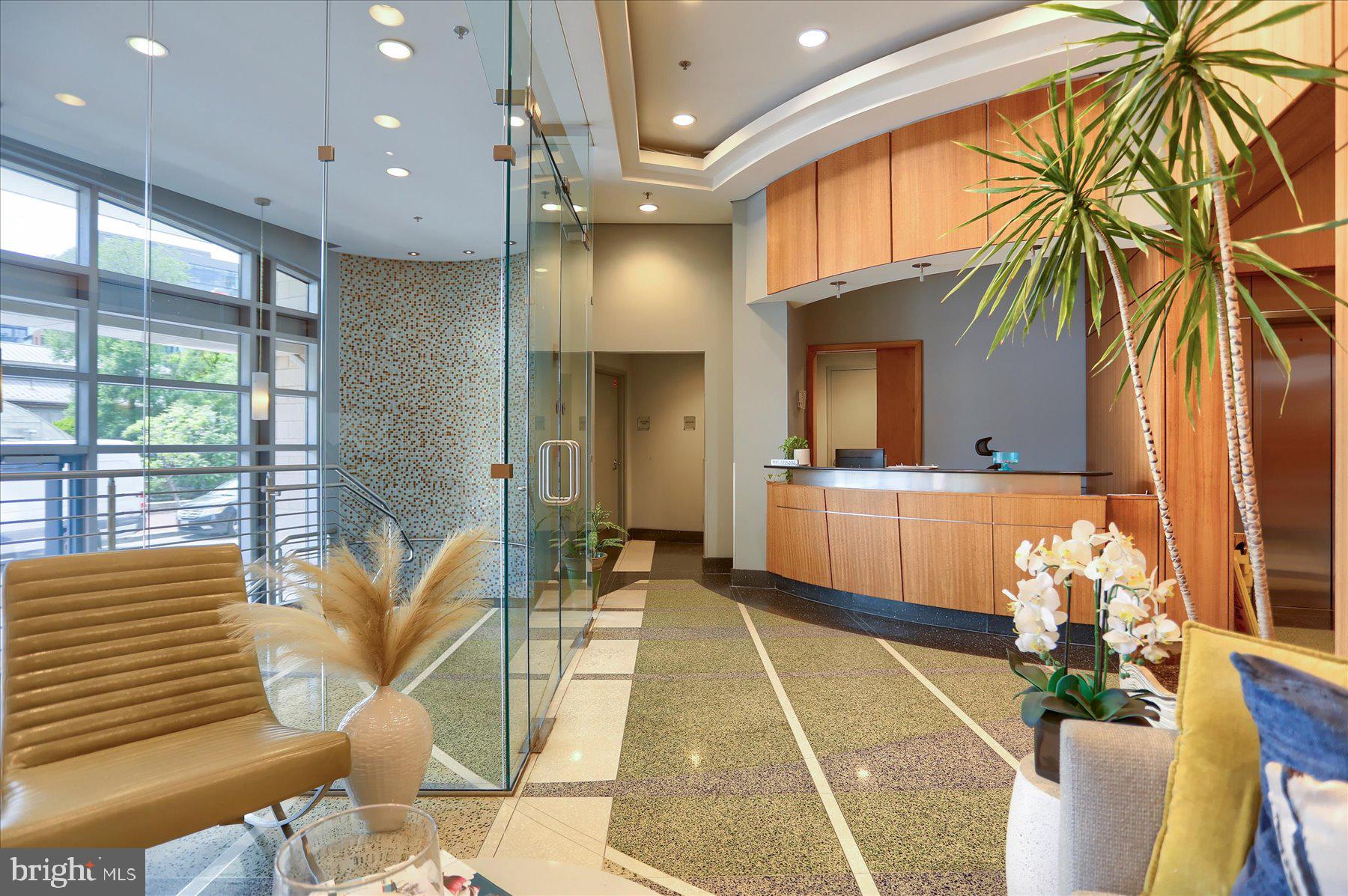 1400 Lancaster Street, Unit 802 Baltimore, MD 21231 - Photo 4 of 34 a lobby with furniture and a potted plant