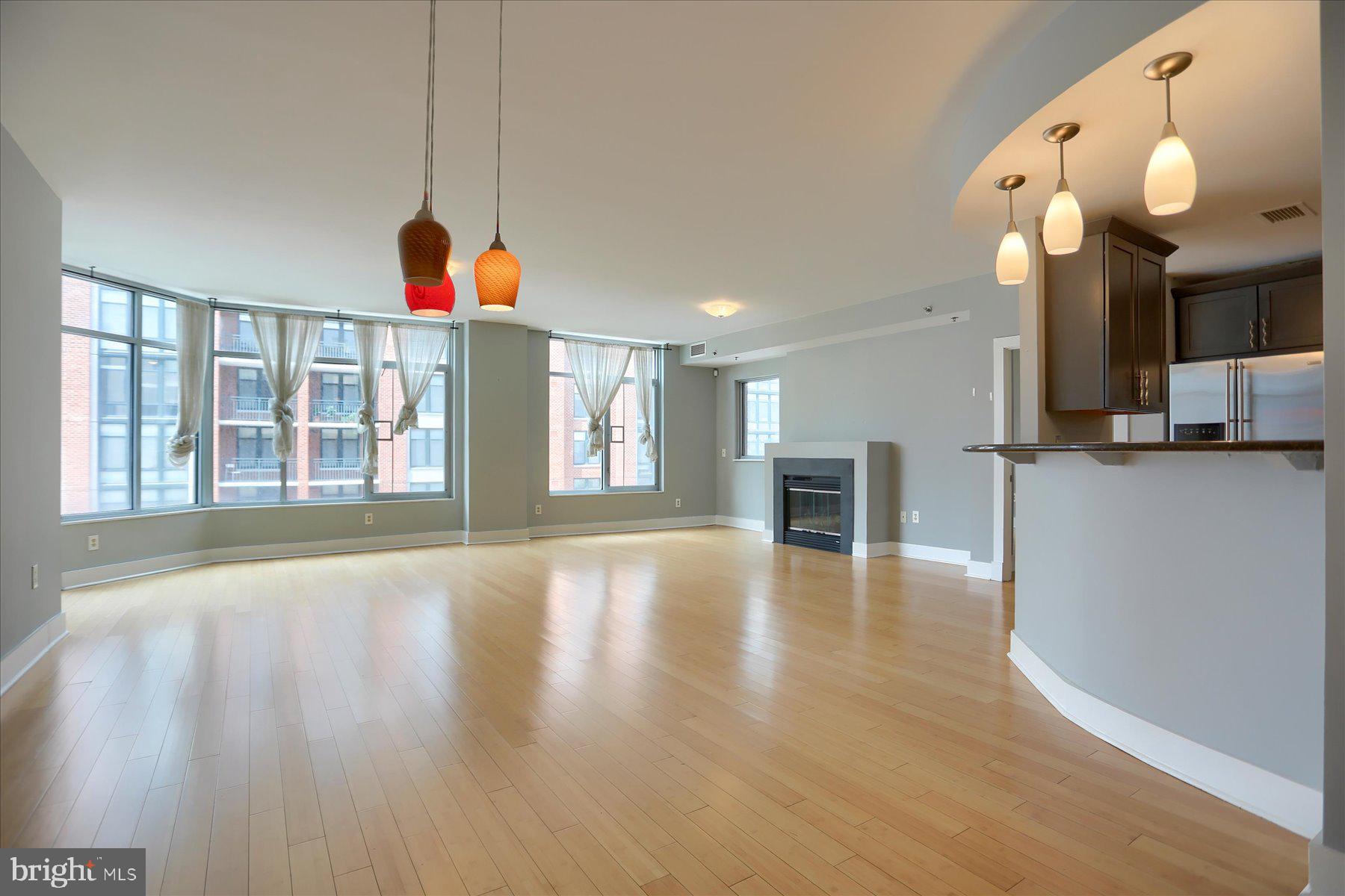 1400 Lancaster Street, Unit 802 Baltimore, MD 21231 - Photo 9 of 34 a view of a livingroom with a kitchen