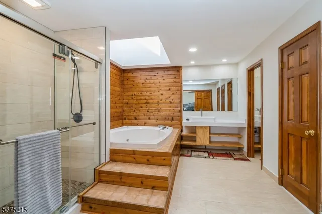 a bathroom with a bathtub and a shower
