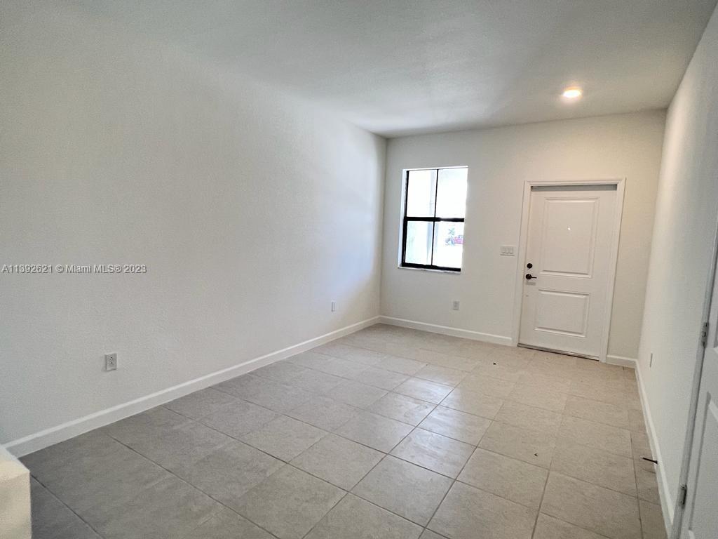 Miami-Dade County Homestead, FL 33032 - Photo 11 of 41 an empty room with windows and closet