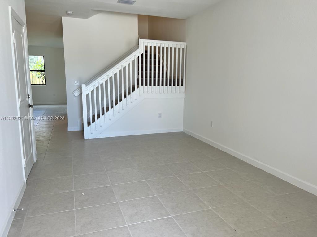Miami-Dade County Homestead, FL 33032 - Photo 12 of 41 a view of entryway with stairs