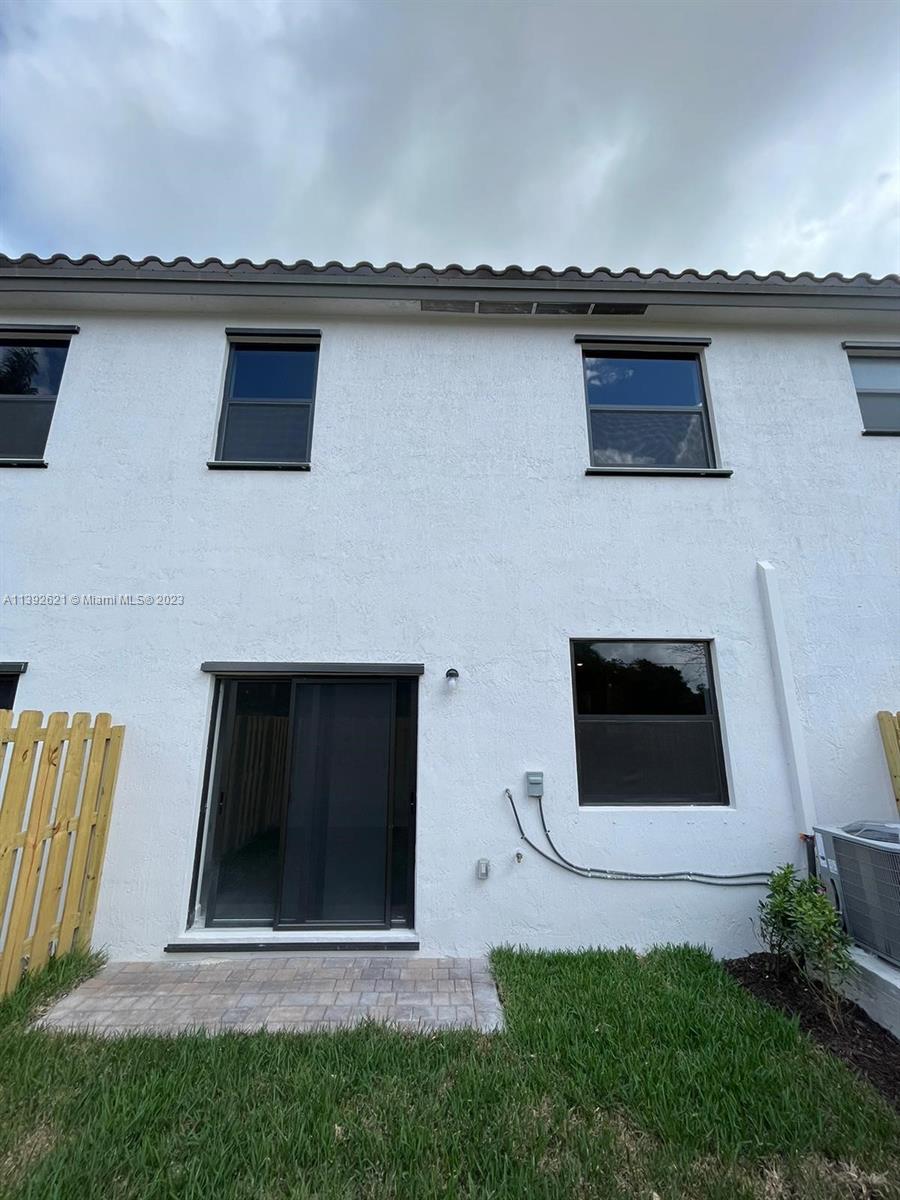 Miami-Dade County Homestead, FL 33032 - Photo 17 of 41 a house view with a garden space