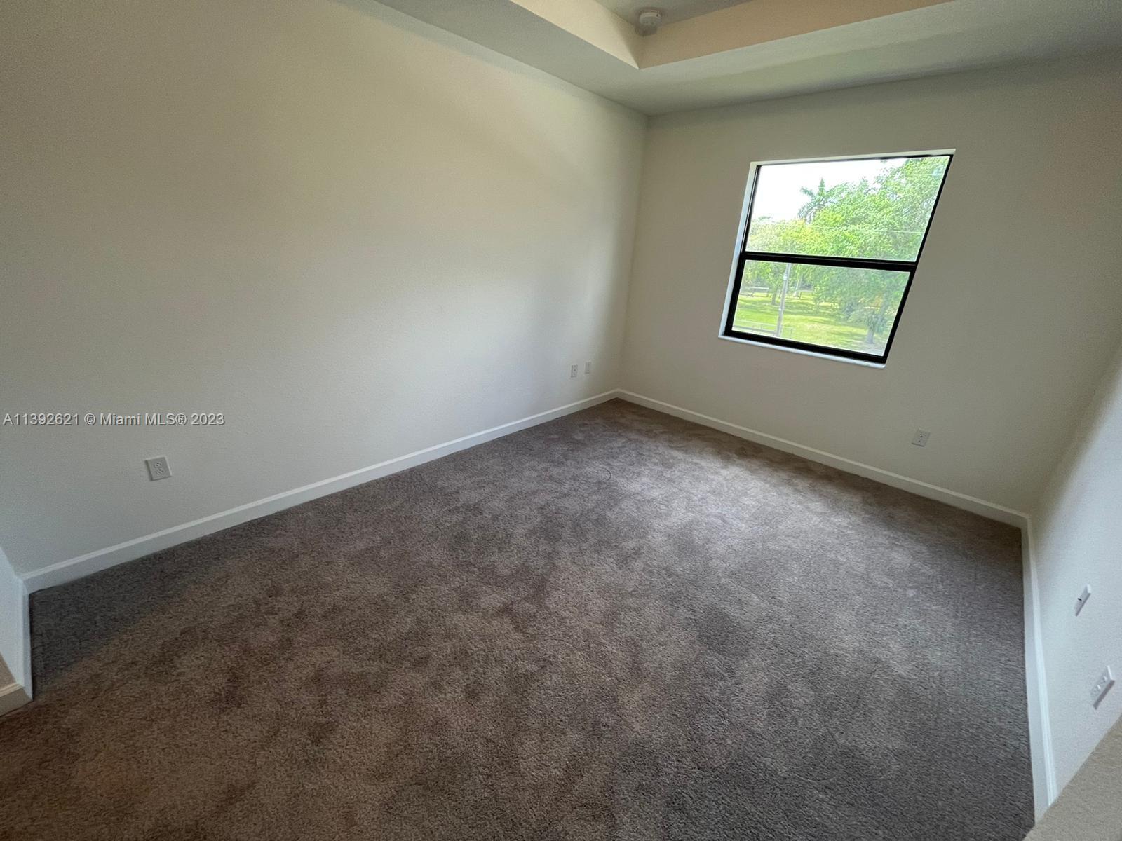 Miami-Dade County Homestead, FL 33032 - Photo 23 of 41 an empty room with a window