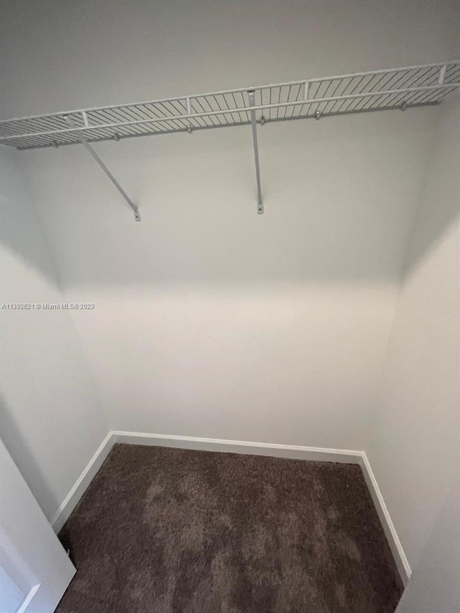 Miami-Dade County Homestead, FL 33032 - Photo 24 of 41 a view of a room with racks on the wall