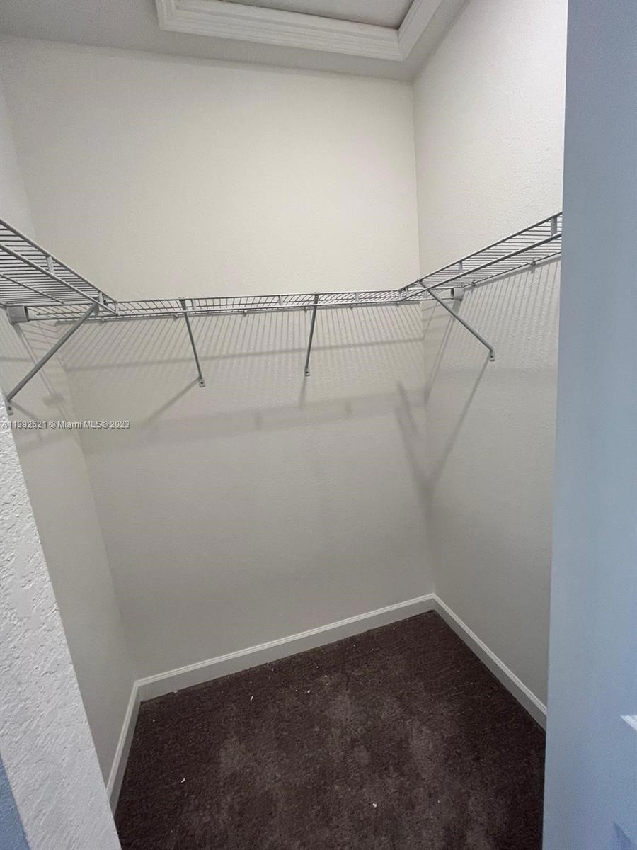 Miami-Dade County Homestead, FL 33032 - Photo 26 of 41 a view of small space with racks on the wall