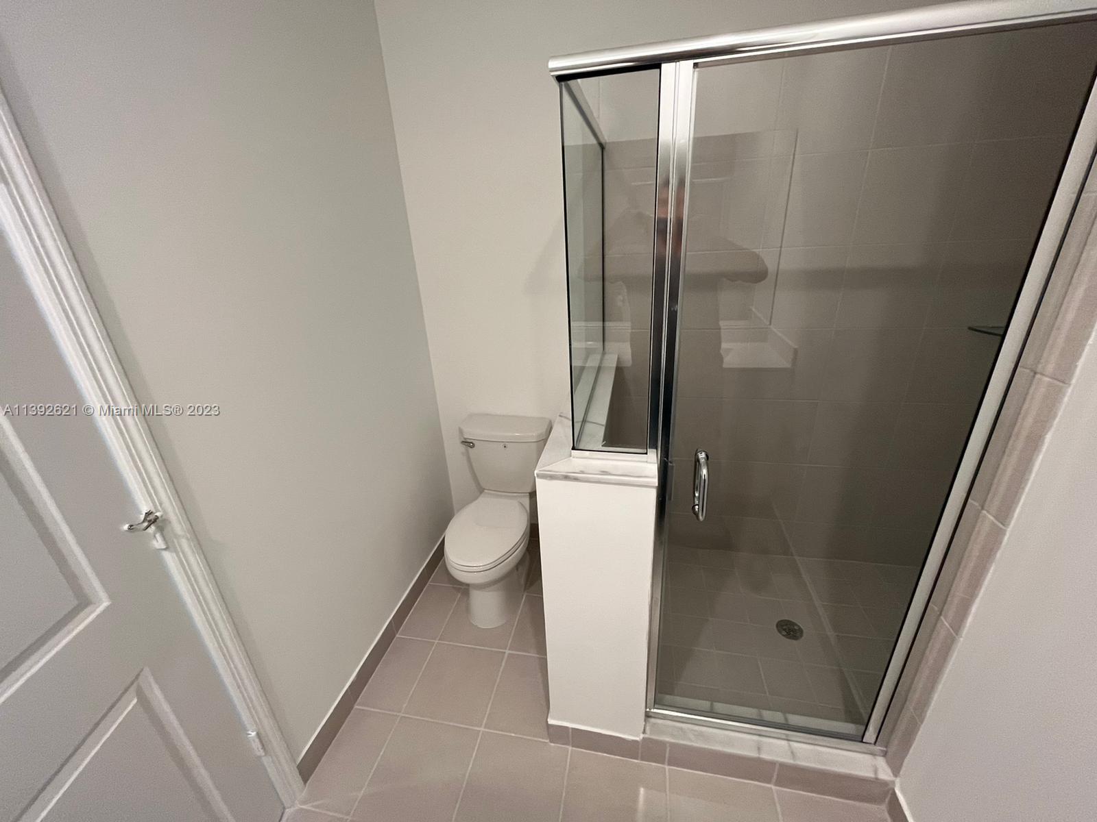 Miami-Dade County Homestead, FL 33032 - Photo 27 of 41 a bathroom with a shower and toilet