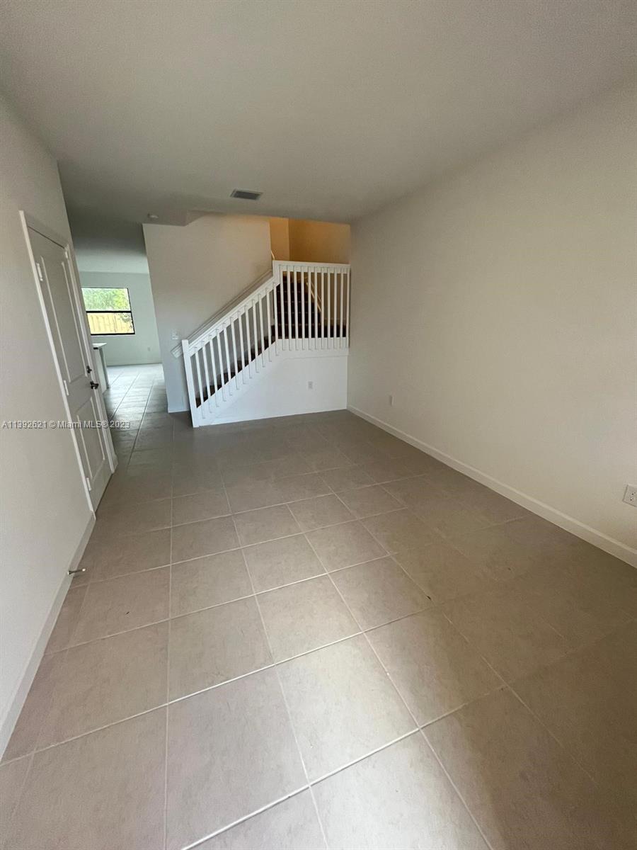 Miami-Dade County Homestead, FL 33032 - Photo 3 of 41 a view of a livingroom with a staircase
