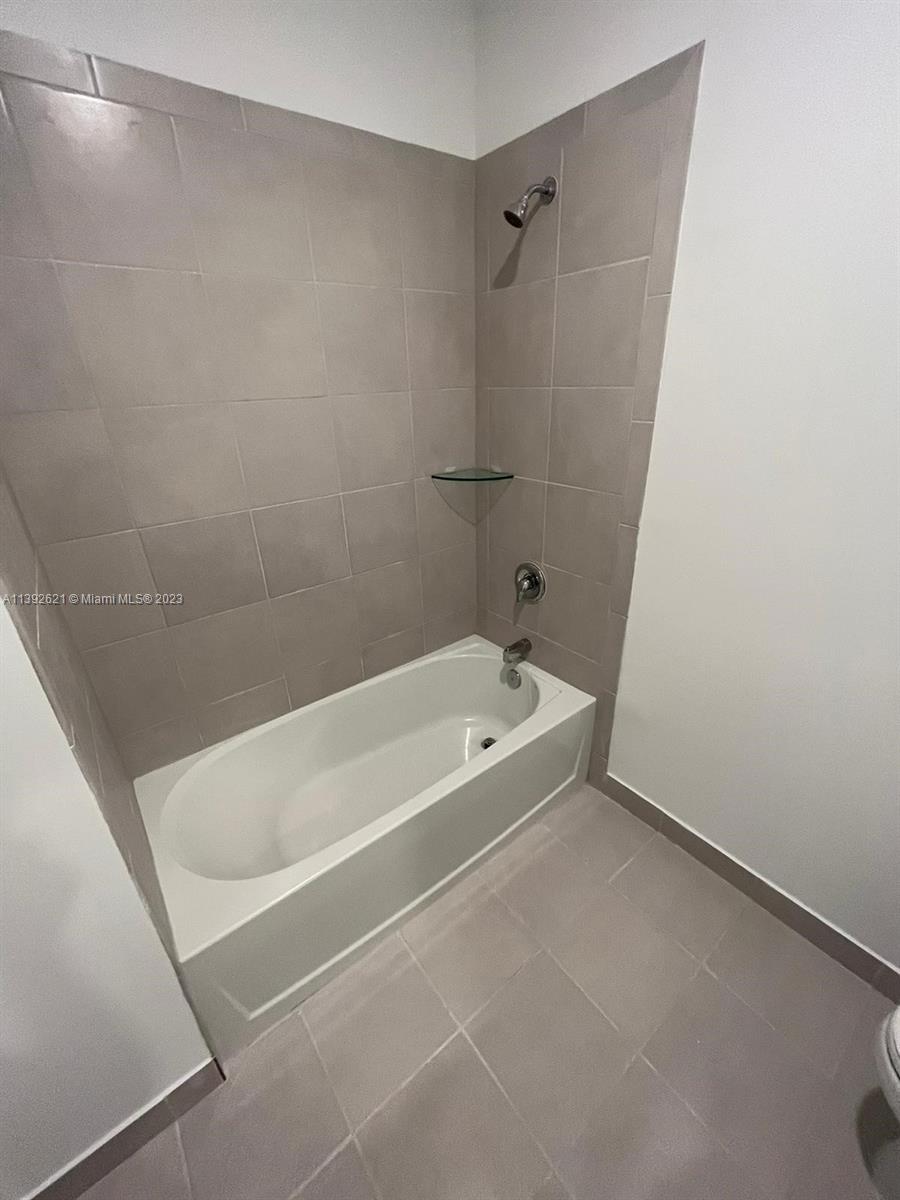 Miami-Dade County Homestead, FL 33032 - Photo 33 of 41 a bath tub sitting next to a white sink