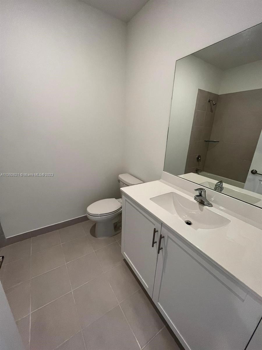 Miami-Dade County Homestead, FL 33032 - Photo 35 of 41 a bathroom with a sink and a toilet