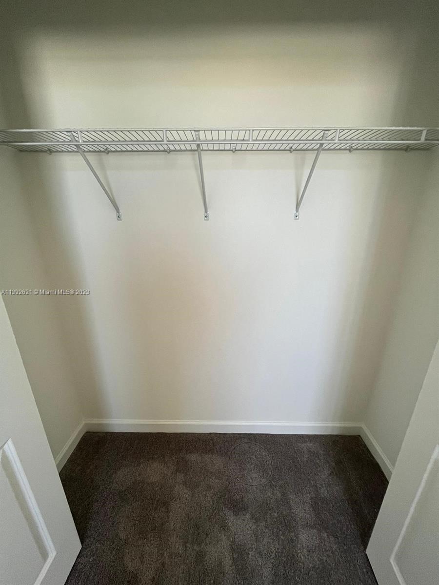 Miami-Dade County Homestead, FL 33032 - Photo 36 of 41 a view of a room with racks on the wall