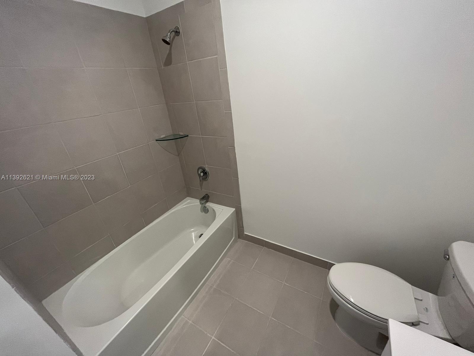 Miami-Dade County Homestead, FL 33032 - Photo 37 of 41 a bathroom with a toilet and a tub