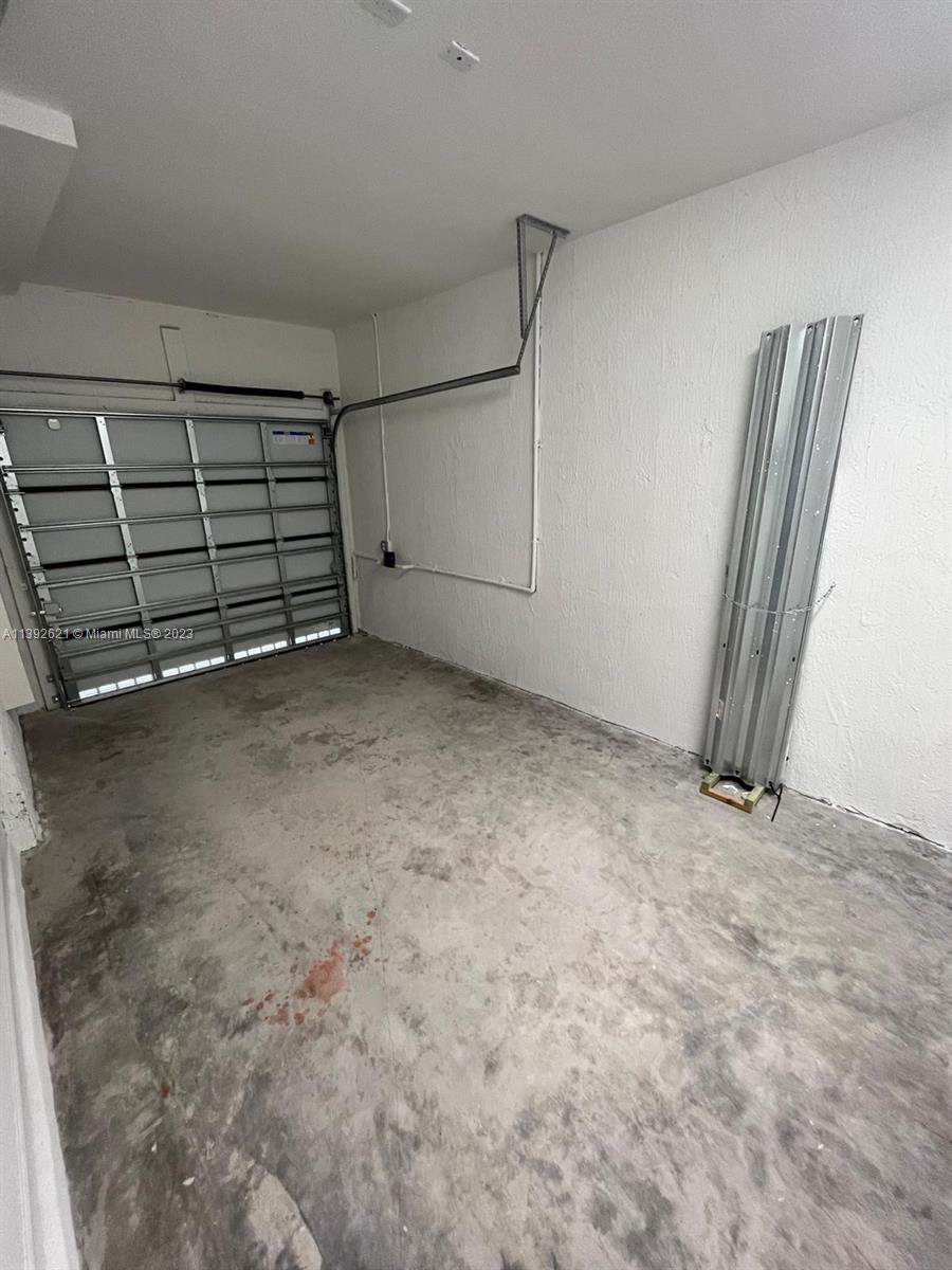 Miami-Dade County Homestead, FL 33032 - Photo 38 of 41 an empty room with staircase