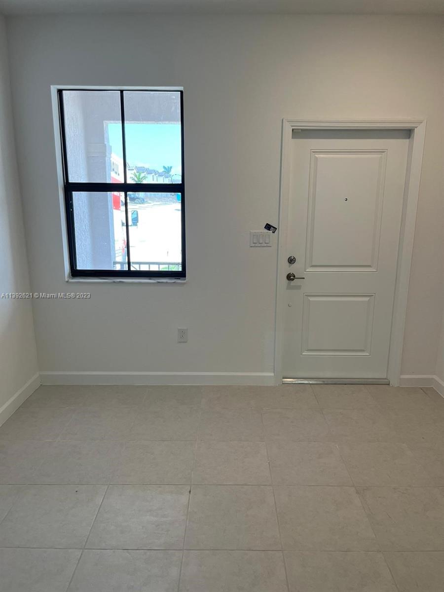 Miami-Dade County Homestead, FL 33032 - Photo 40 of 41 an empty room with a window