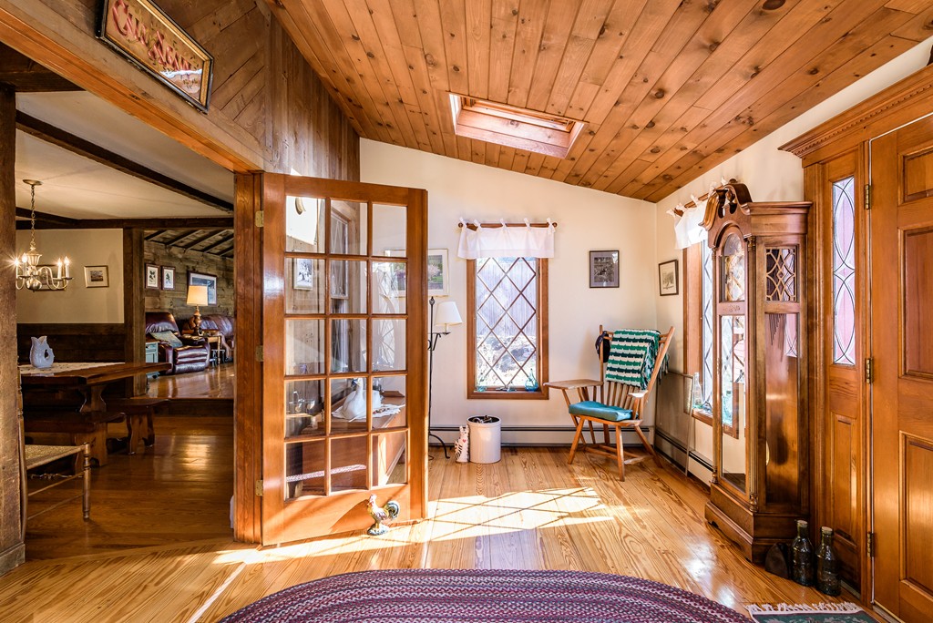 63 Johnson Street Boston, MA 02132 - Photo 2 of 13 a view of living room with furniture and floor to ceiling window