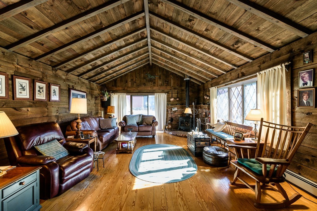 63 Johnson Street Boston, MA 02132 - Photo 4 of 13 a living room with furniture and wooden floor