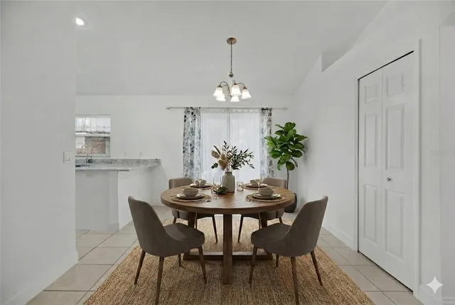 a kitchen with a sink a refrigerator and a stove