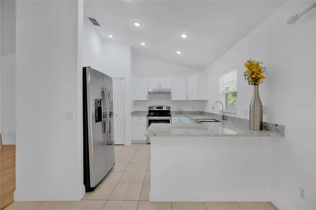 a kitchen with a sink and a window