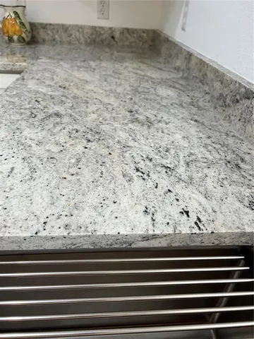 a bedroom with bed and a chandelier