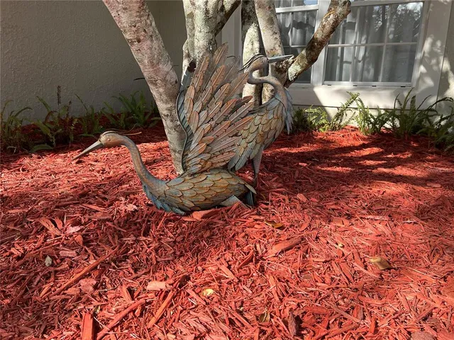 a view of an empty room with a bathroom and a window
