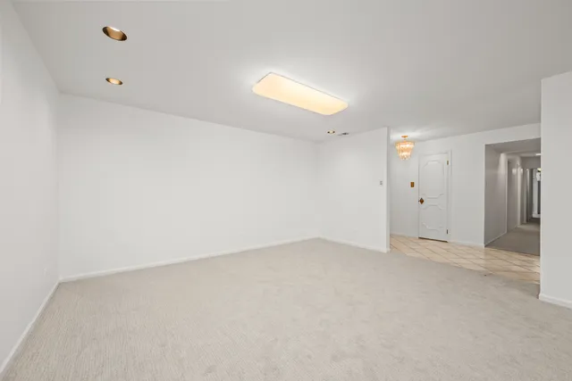 a kitchen with stainless steel appliances a stove a sink and a refrigerator