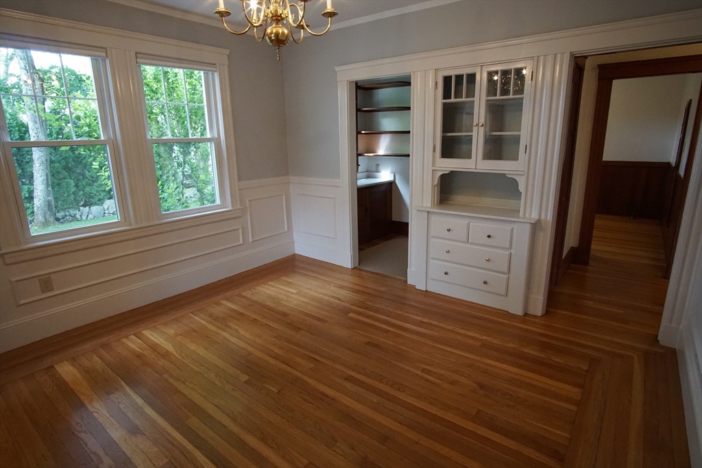 754 Massachusetts Avenue, Unit 1 Lexington, MA 02421 - Photo 7 of 17 a bedroom with a bed and a window